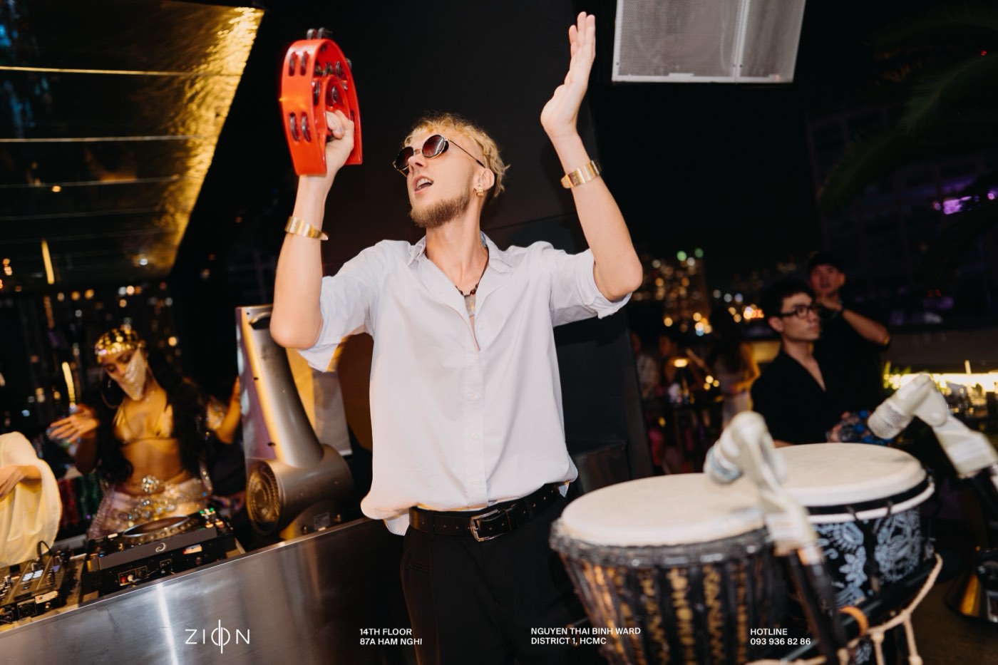 Tambourine in hand at ZION Sky Lounge